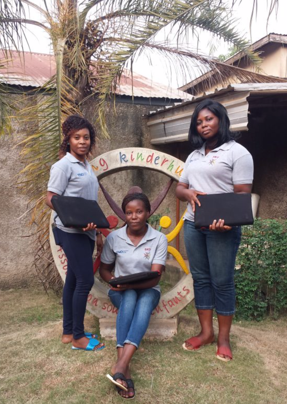 Three of the data-assistants who helped to digitize the paper files. Reproduced with permission from Stichting Kinderhulp Togo https://www.kinderhulp-togo.nl.